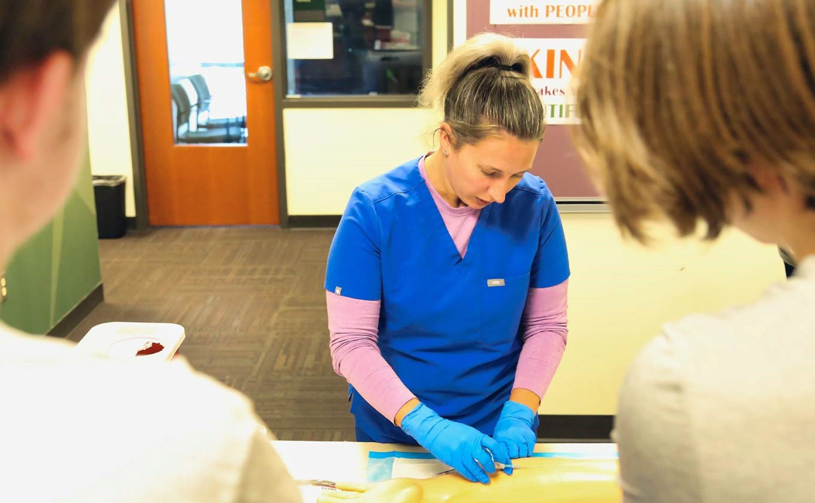Shannon Swendsen, a nursing instructor at VPCC, provides hands-on activities at the college's open house in Williamsburg.