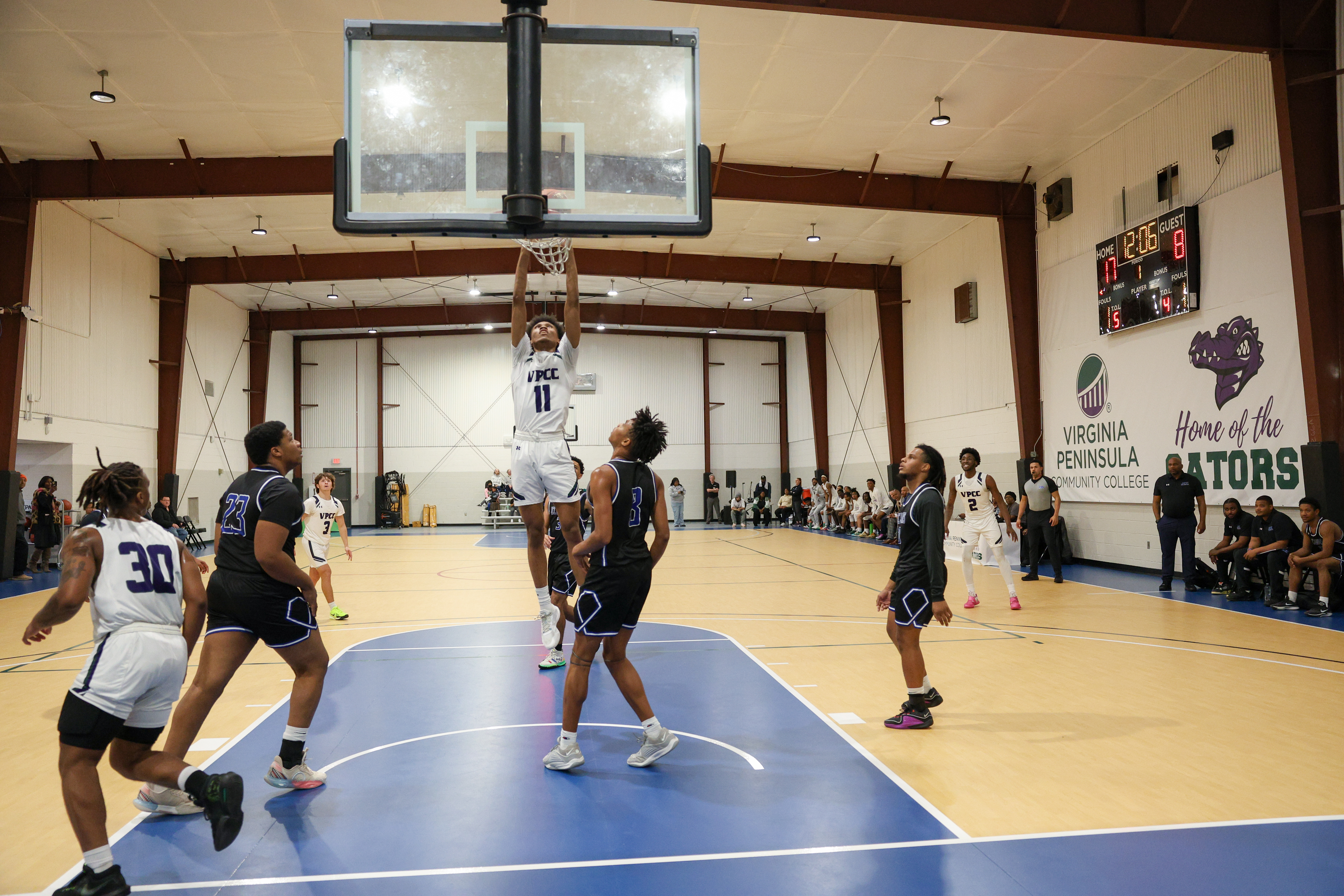 Sincere Moore dunks for two points against Johnston Community College.