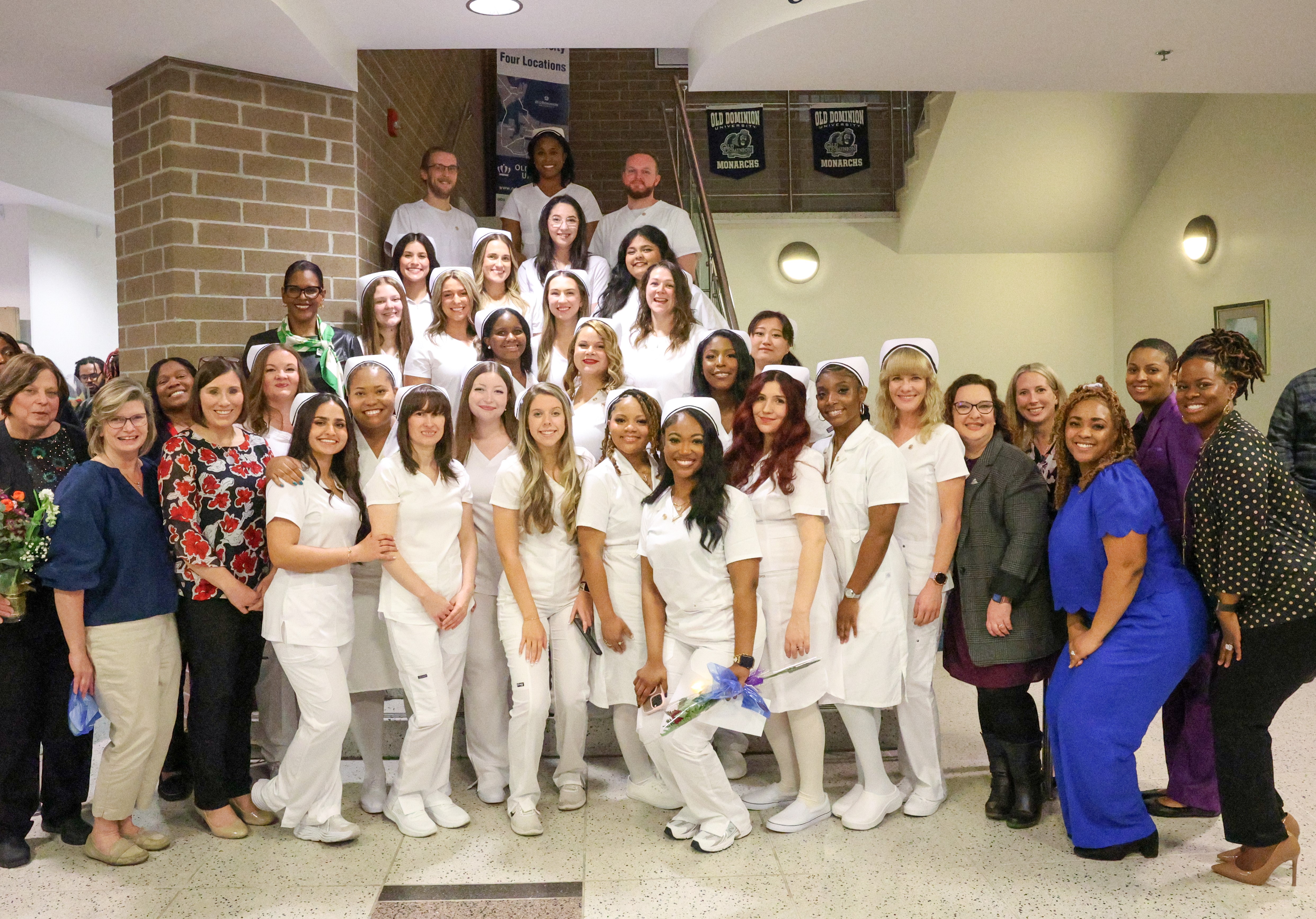 Students and staff celebrate after the pinning ceremony.