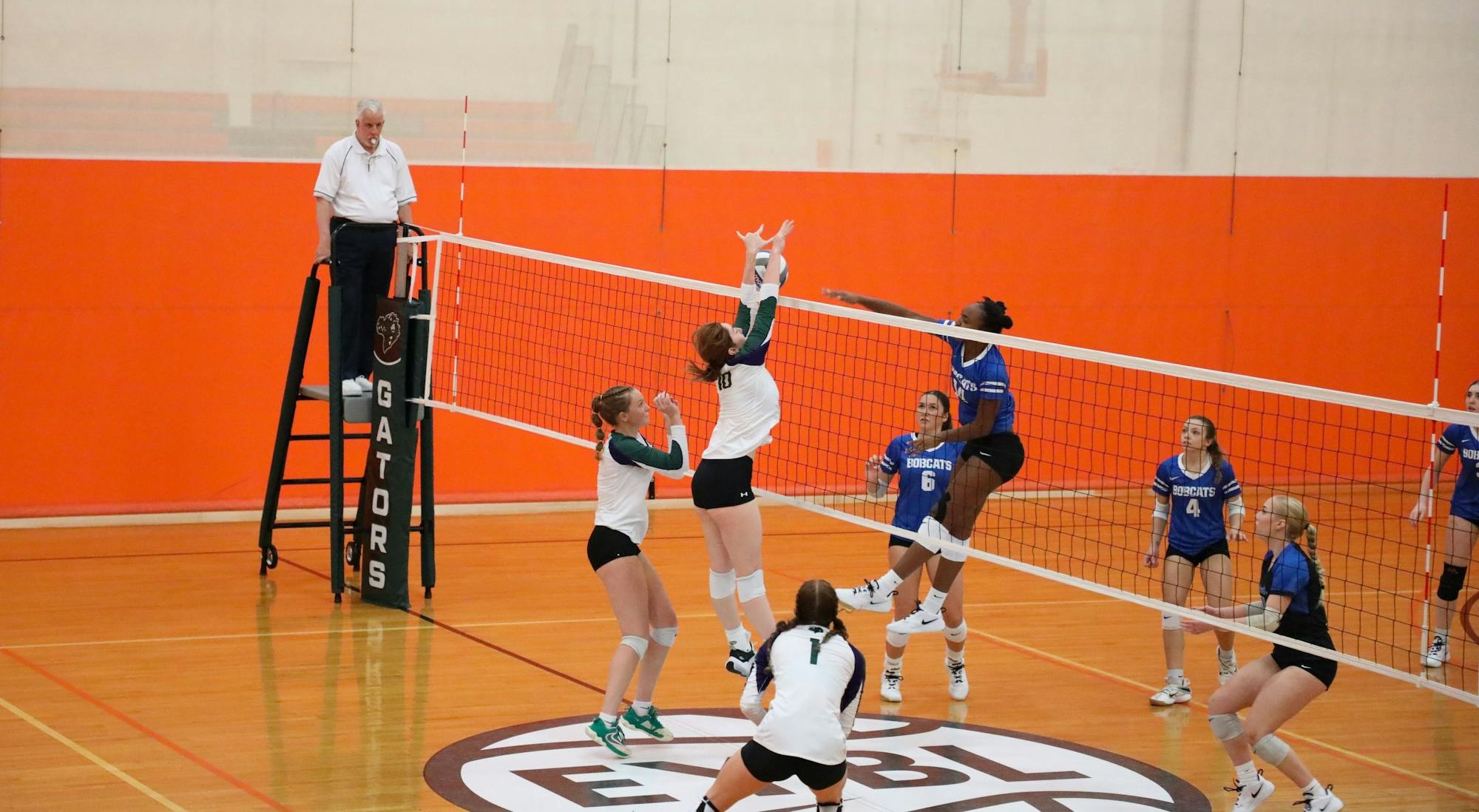 Ashleigh Yost blocks a spike in VPCC's match against Bryant & Stratton