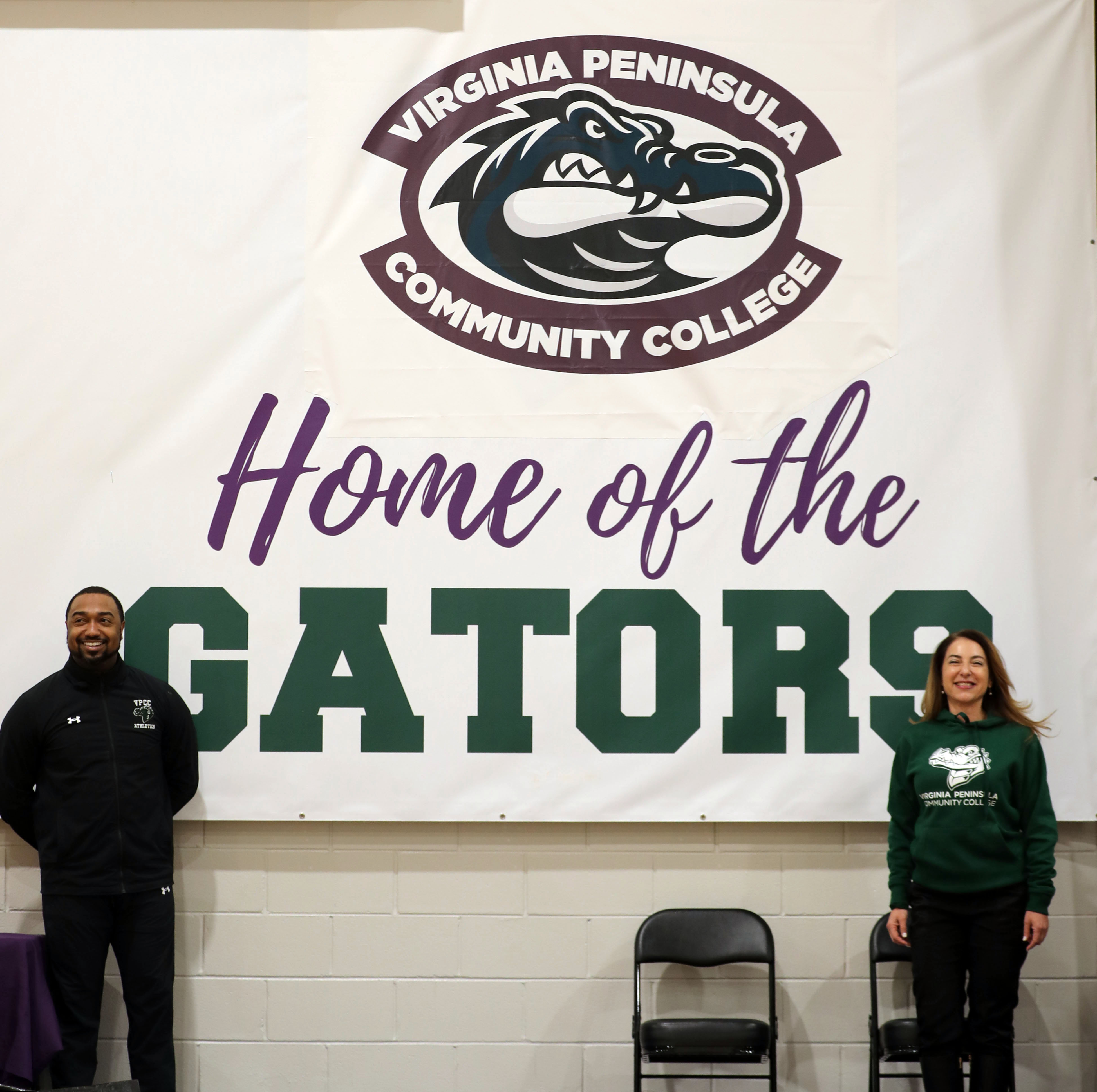 Chris Moore and Daniela Cigularova unveiled the new logo at the final men's basketball home game of the season.