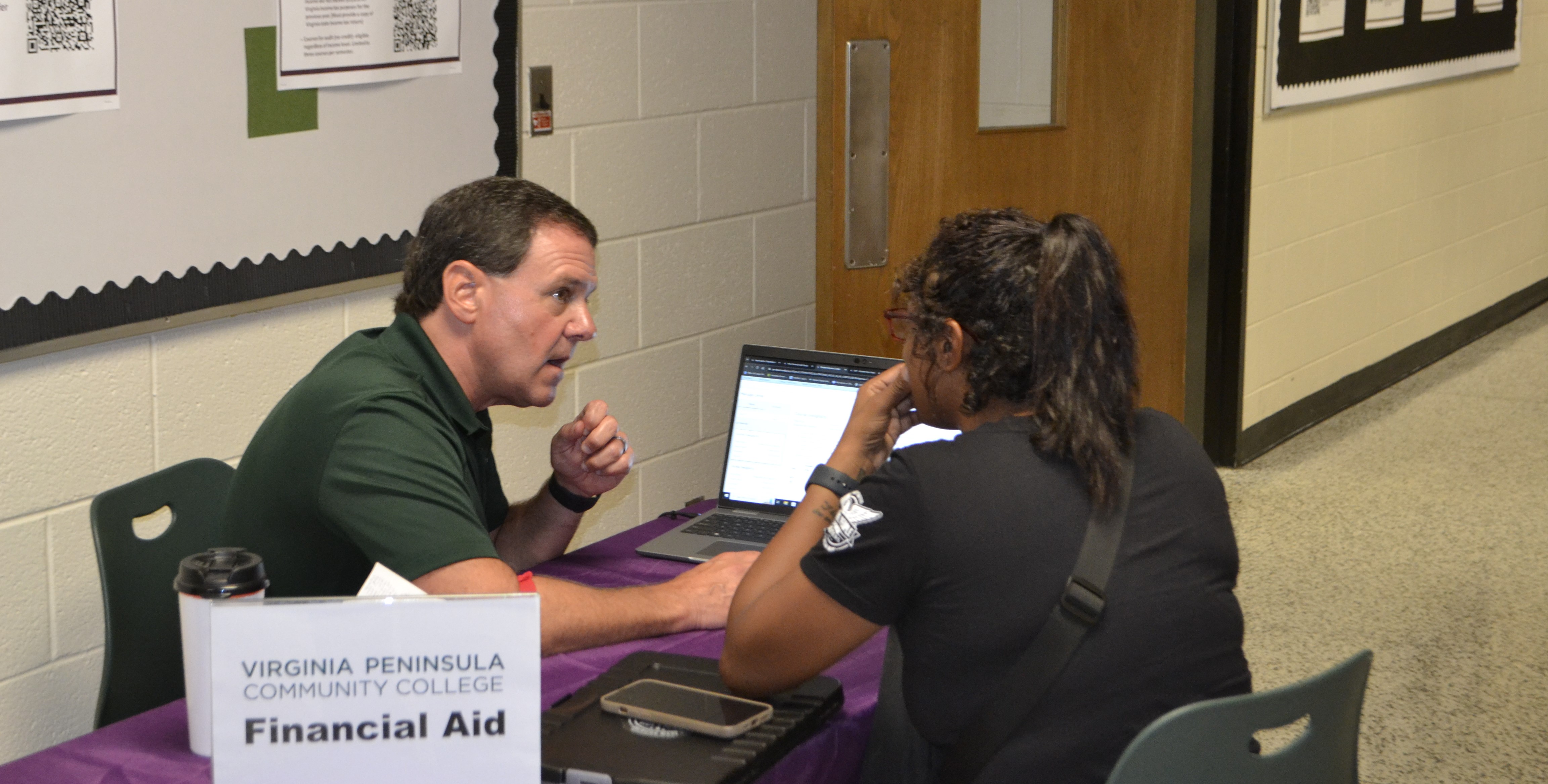 The College's Marc Vernon helping a potential student.